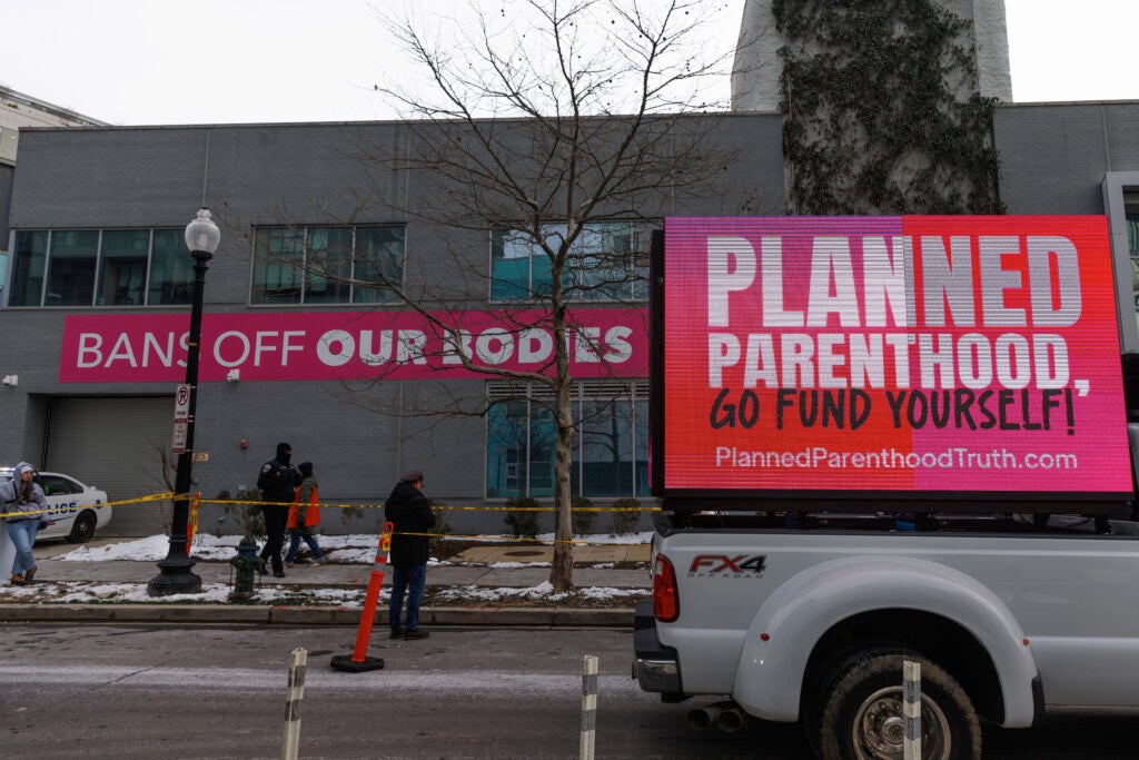 Pro- and anti-abortion protesters square off in front of a Planned Parenthood clinic in Washington, D.C., on Jan. 18, 2024.
