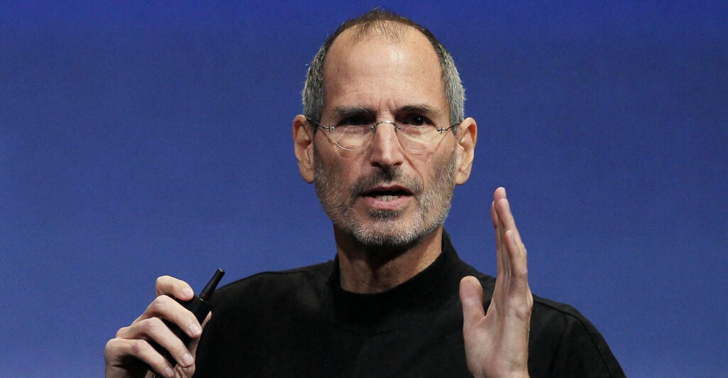 Steve Jobs wearing a black shirt while gesturing.
