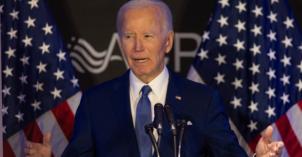 Joe Biden blue suit American flags