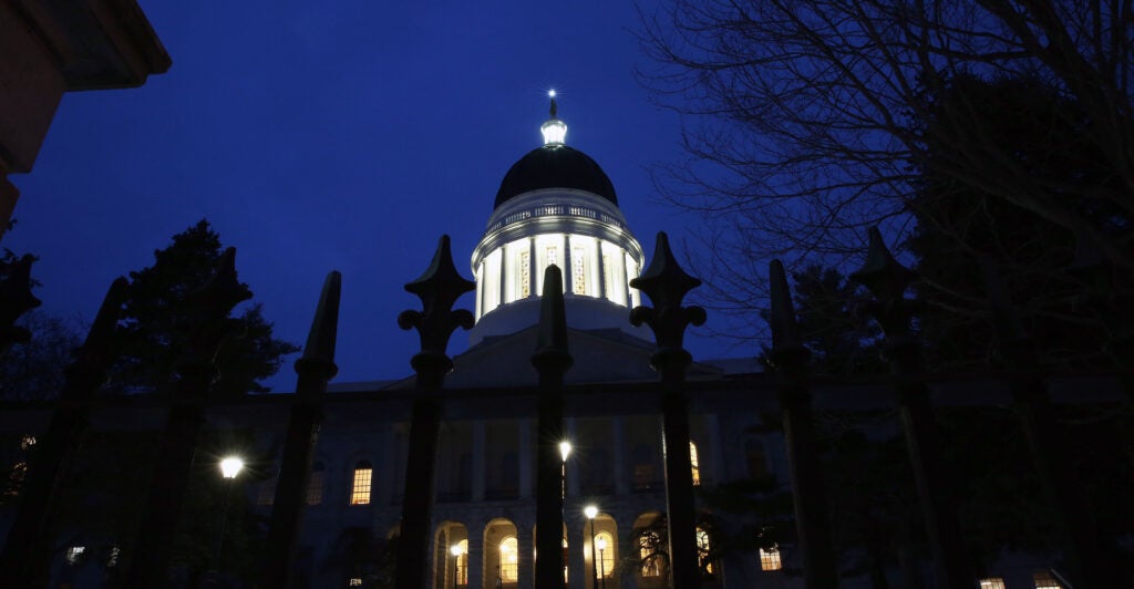The Maine State House at dusk.