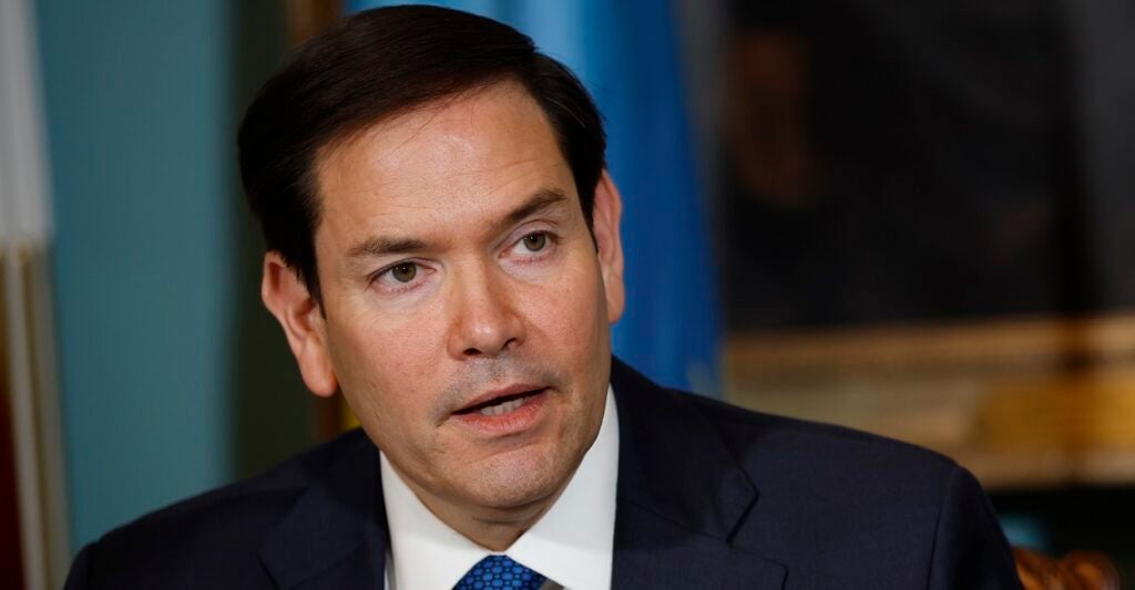 Marco Rubio looks to his left while giving a speech.