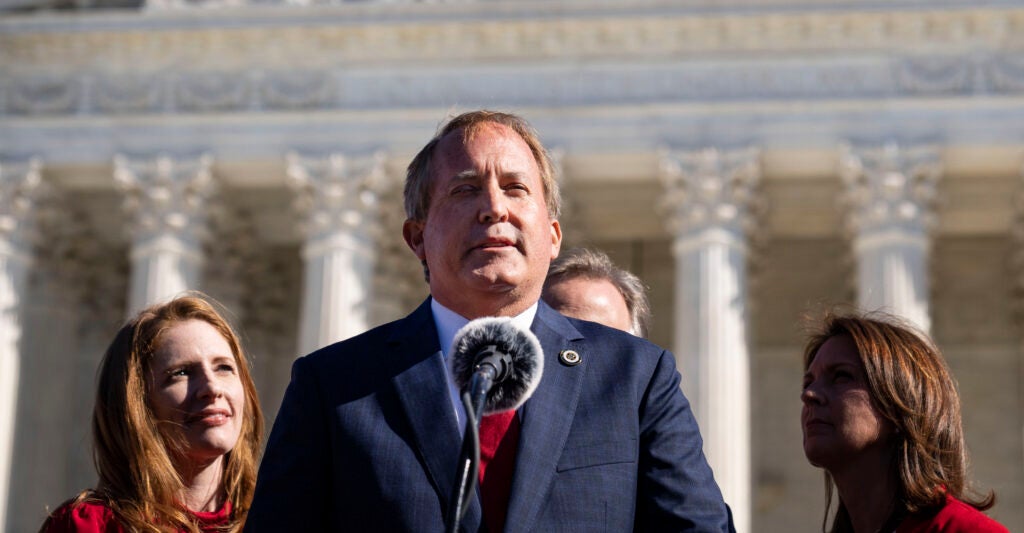 Texas Attorney General Ken Paxton speaks in front of the U.S. Supreme Court building.