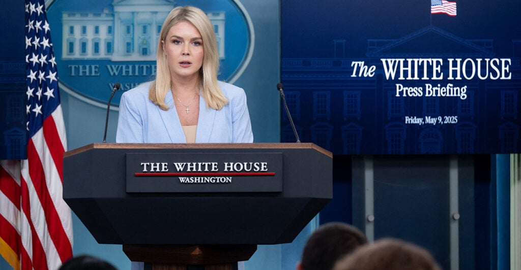 White House Press Secretary Karoline Leavitt in a light blue suit holds press briefing at the White House.
