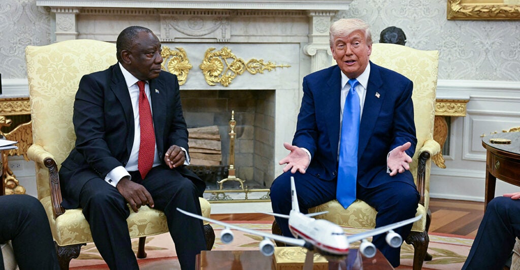 President Donald Trump confers with South African President Cyril Ramaphosa in the Oval Office on Wednesday.