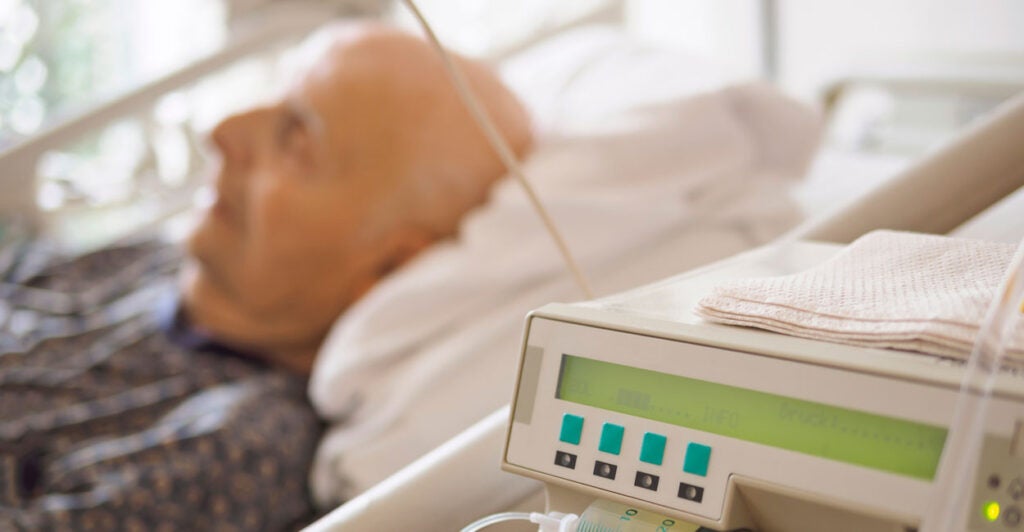 An elderly man on palliative care in a hospital setting