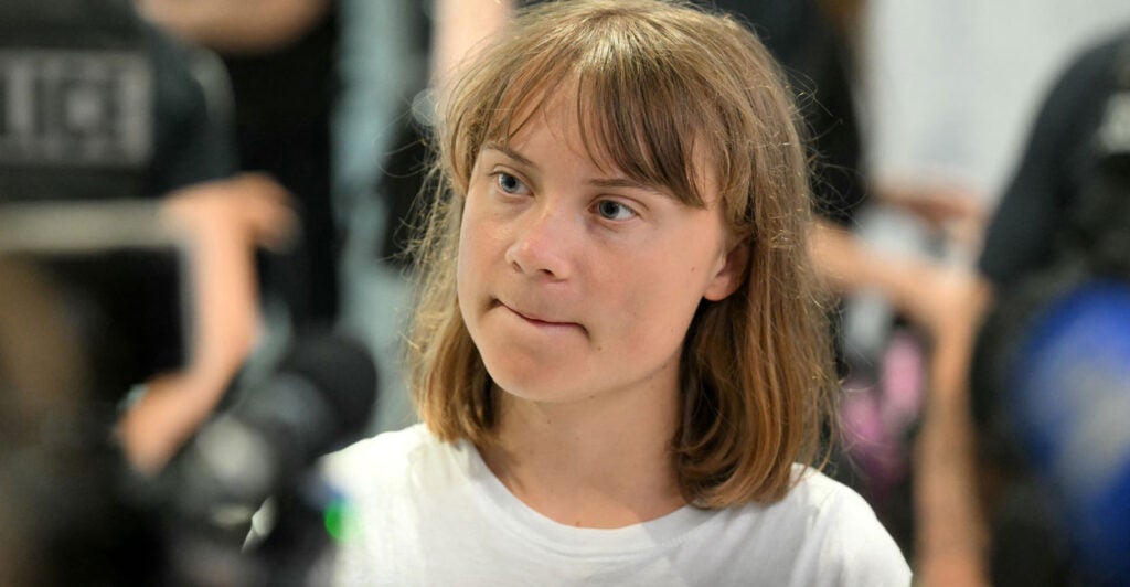 22-year-old Swedish left-wing activist Greta Thunberg talks with reporters.