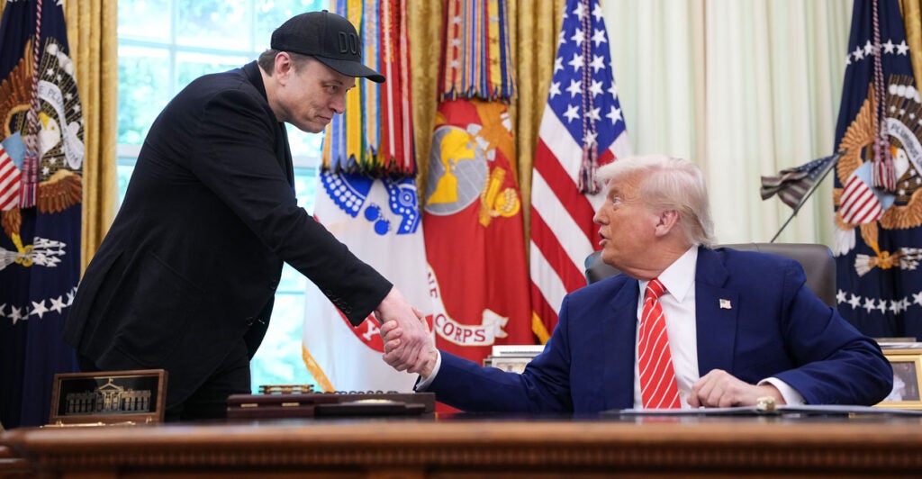 Before their falling out, Elon Musk is given a warm send-off with a handshake from President Donald Trump in the Oval Office on May 30.