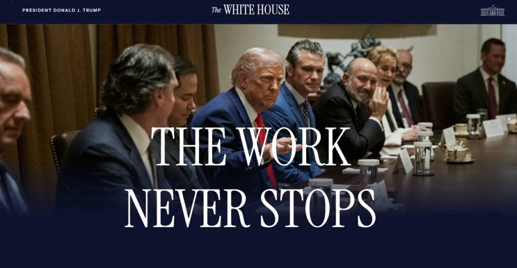 President Donald Trump sits with his Cabinet in an image overlayed with the phrase "The Work Never Stops."
