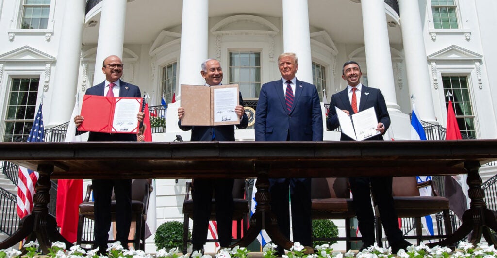 From left: Bahraini Foreign Minister Abdullatif Al Zayani, Israeli Prime Minister Benjamin Netanyahu, President Donald Trump, and UAE Foreign Minister Abdullah bin Zayed Al Nahyan hold up documents after participating in the signing of the Abraham Accords at the White House on Sept. 15, 2020.