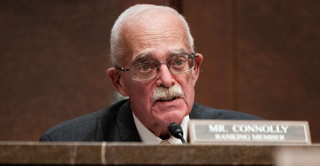 Rep. Gerry Connolly in a suit speaking at a congressional committee hearing