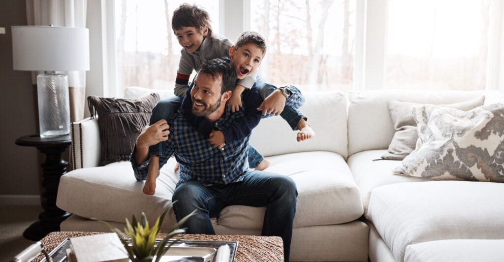 Father playing with sons.