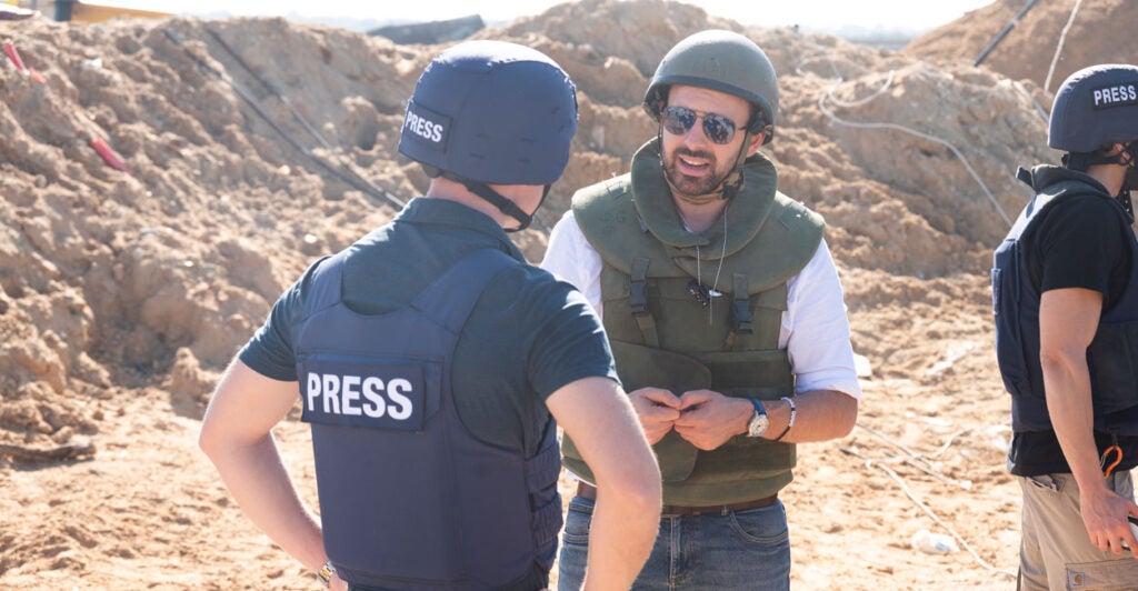 Eylon Levy, then-Israeli government spokesman, speaks with journalists near a tunnel in northern Gaza.