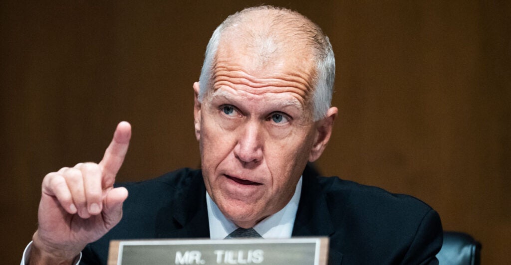 Sen. Thom Tillis, R-N.C., gestures during a committee hearing.