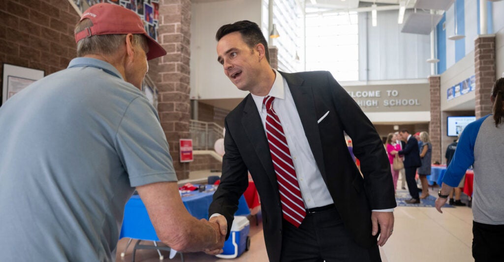 candidate Stewart Whitson shakes a voters hand