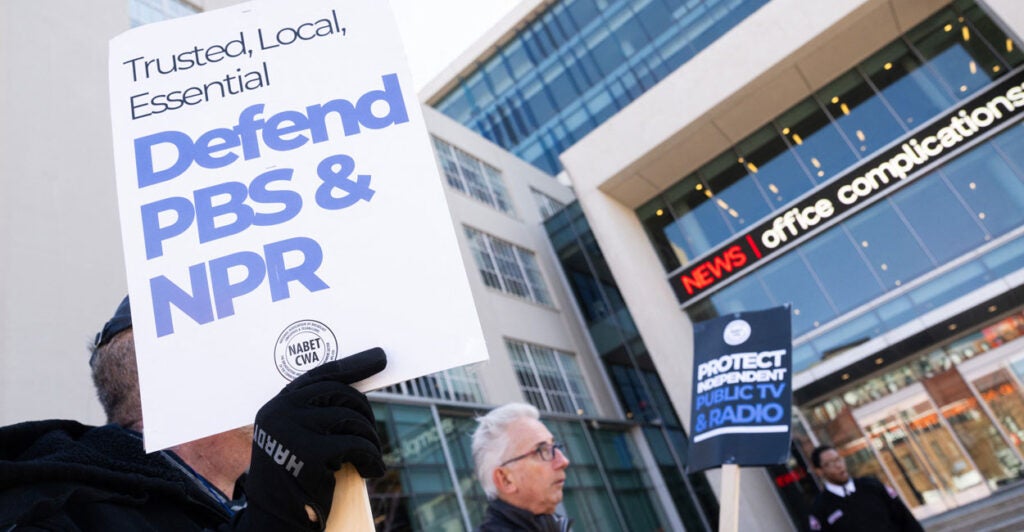 Opponents of cutting federal funding for PBS and NPR demonstrate outside NPR headquarters in Washington on March 26.
