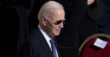 Joe Biden walks with sunglasses on at the Pope's funeral at the Vatican in Rome.