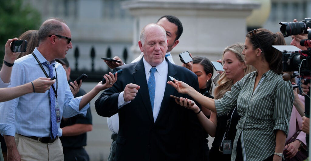 White House border czar Tom Homan talks with reporters near the White House on Monday.