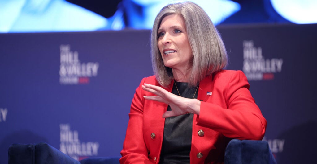Sen. Joni Ernst, R-Iowa, wearing a red blazer