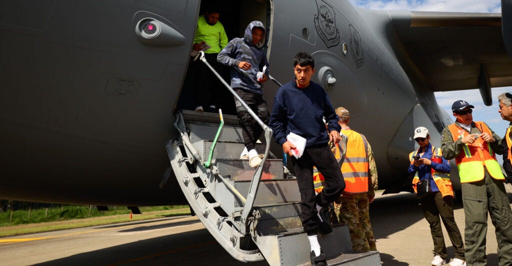 Deported illegal immigrants arrive from the U.S. in a military plane at an airport in Cortes, Honduras, on Jan. 31.