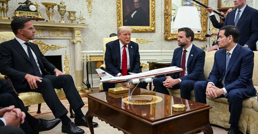 President Donald Trump confers with NATO Secretary-General Mark Rutte (left) at the White House on Monday, with Vice President JD Vance (second from right) and Secretary of State Marco Rubio looking on.