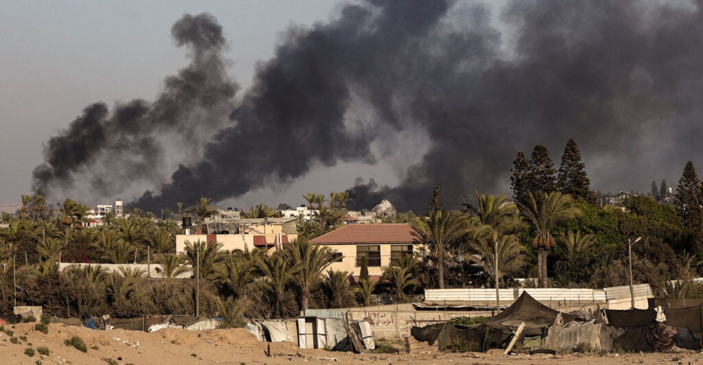 Smoke is seen rising from rising from Deir al-Balah, Gaza, on Monday.