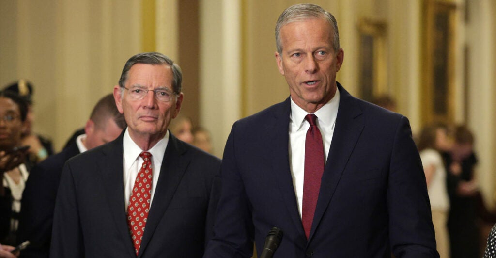 Senate Majority Leader John Thune, R-S.D., left, speaks as Senate Majority Whip Sen. John Barrasso, R-Wy., listens during a news briefing after the weekly Senate Republican policy luncheon at the U.S. Capitol on July 22, 2025 in Washington, DC.