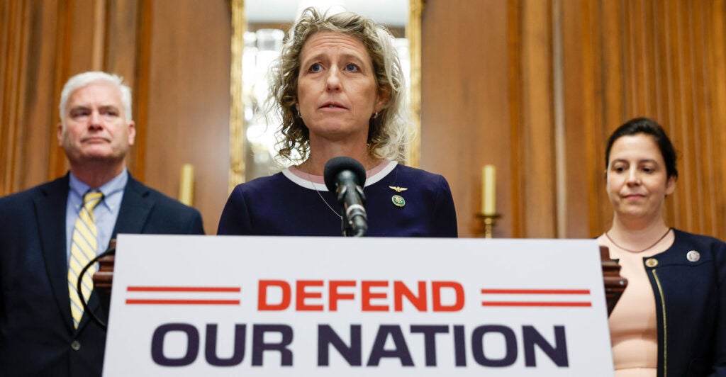 Flanked by two House Republican colleagues, Rep. Jen Kiggans, R-Va., speaks to reporters at the Capitol on July 14, 2023.
