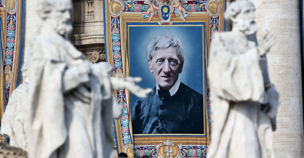 A tapestry featuring a portrait of St. John Henry Newman is draped from the balcony overlooking St. Peter's Square during a canonization ceremony held by then-Pope Francis on Oct. 13, 2019, in Vatican City.