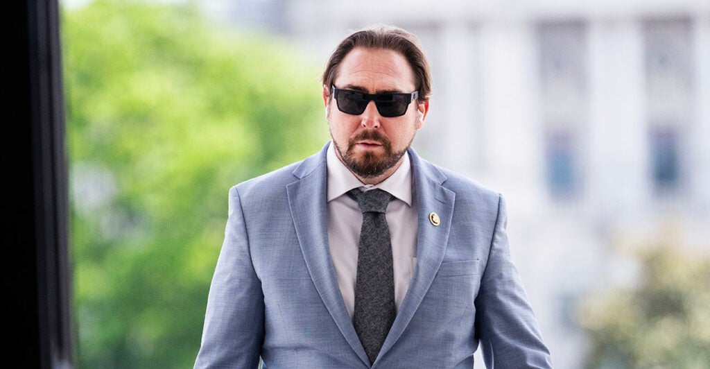 Eli Crane in a blue suit