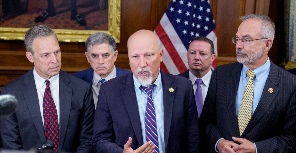 Freedom Caucus members stand in the Capitol's Rayburn room.