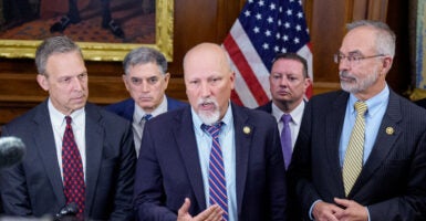 Freedom Caucus members stand in the Capitol's Rayburn room.