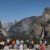 Visitors take in the scenery from Tunnel View in Yosemite National Park.
