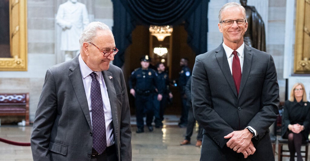 Senate Minority Leader Chuck Schumer, D-N.Y. (left), and Senate Majority Leader John Thune, R-S.D., in the Capitol Rotunda