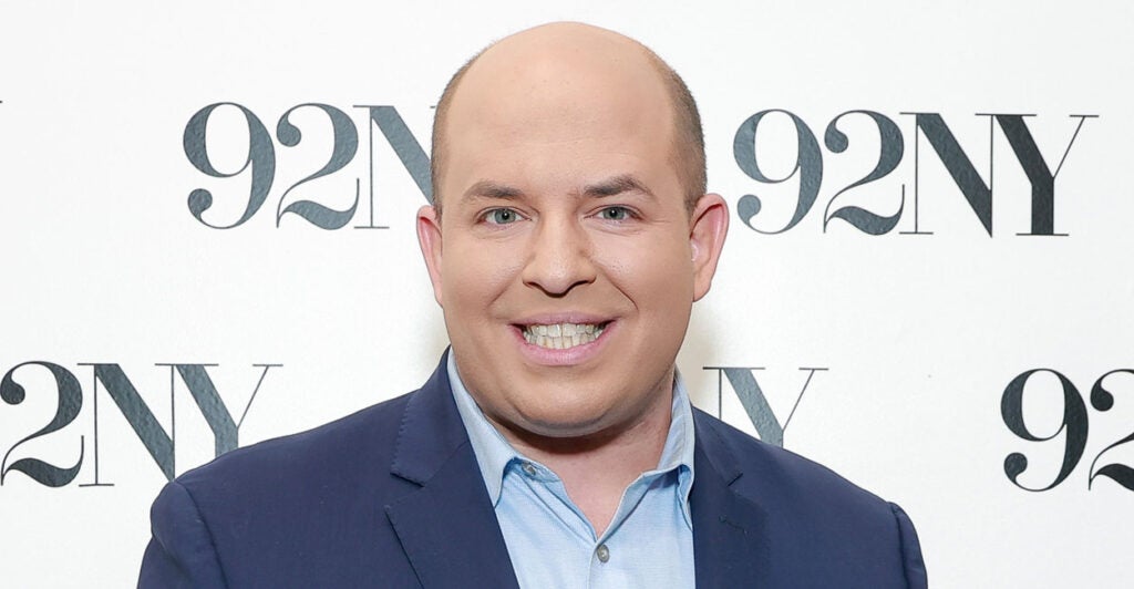 CNN's Brian Stelter, seen here on Nov. 14, 2023, in New York City with a backdrop that says "92NY"