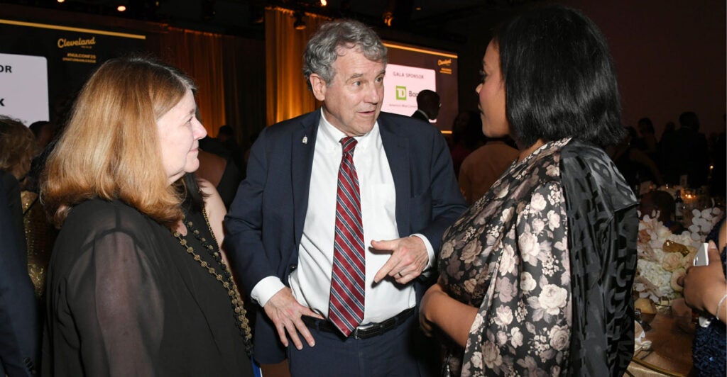 Former Sen. Sherrod Brown, D-Ohio, chats at an event.