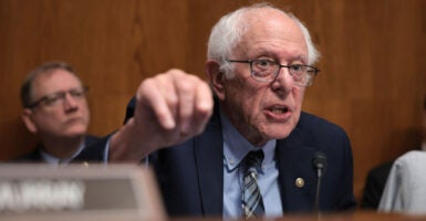 Senator Bernie Sanders uses his hand to emphasize a point at a Senate hearing