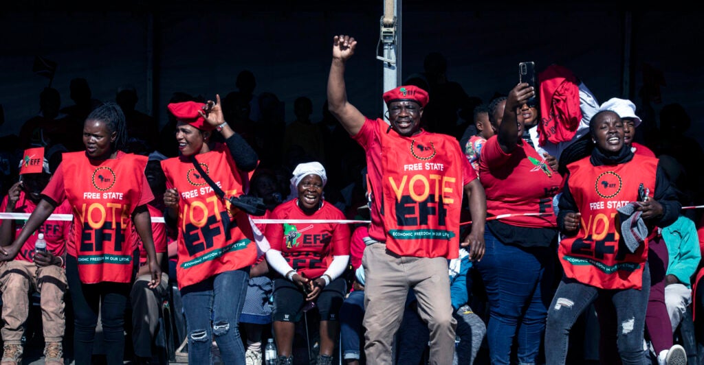 Economic Freedom Fighter supporters sing and dance when Marxist party leader Julius Malema sings "Kill the Boer, kill the farmer" at a campaign appearance on May 25 in Koppies, South Africa.
