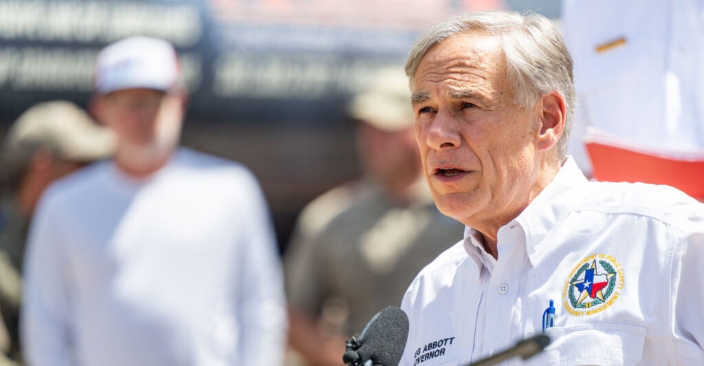 Gov. Greg Abbott looks directly at the camera while answering questions.