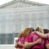 A group of women pray outside the US Supreme Court, on the final day of the Court's term, in Washington, DC, on June 27, 2025.