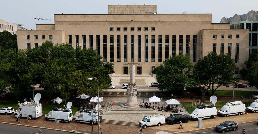 Media tents and television satellite trucks sit parked outside of the E. Barrett Prettyman U.S. District Court House on August 01, 2023 in Washington, DC.