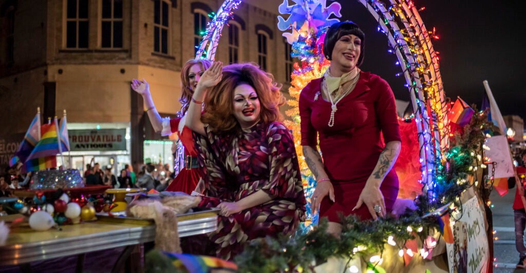 Drag queens Felicia Enspire, Alexandria Van Cartier and Sedonya Face sit on a float at a Christmas parade on Saturday, Dec 3 in Taylor, TX.