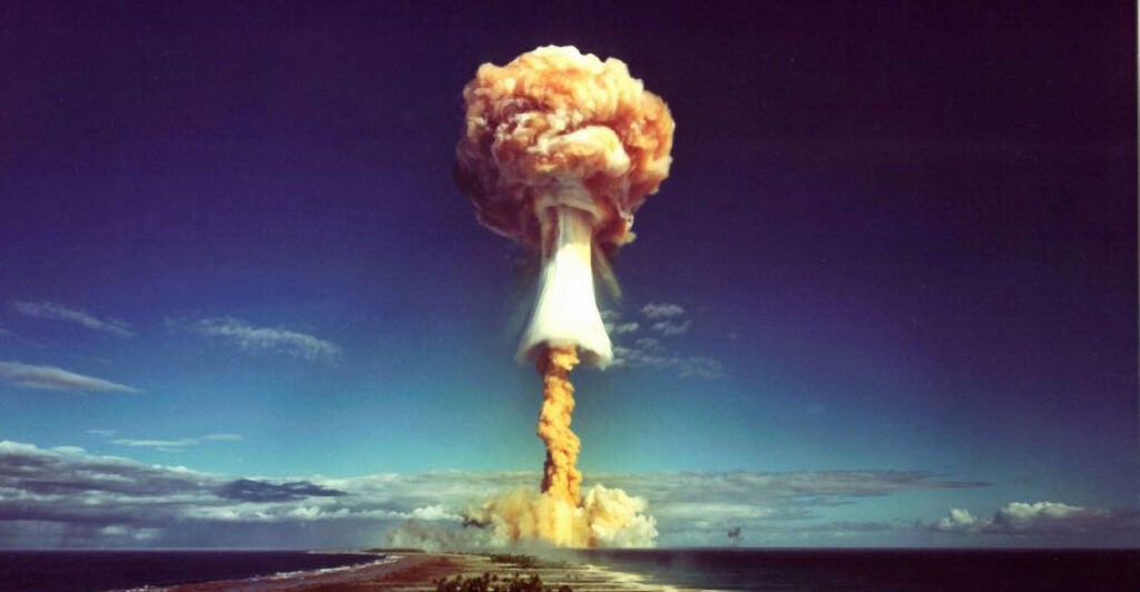 A mushroom cloud after the explosion of a French atomic bomb above the atoll of Mururoa, also known as Aopuni. 1971.