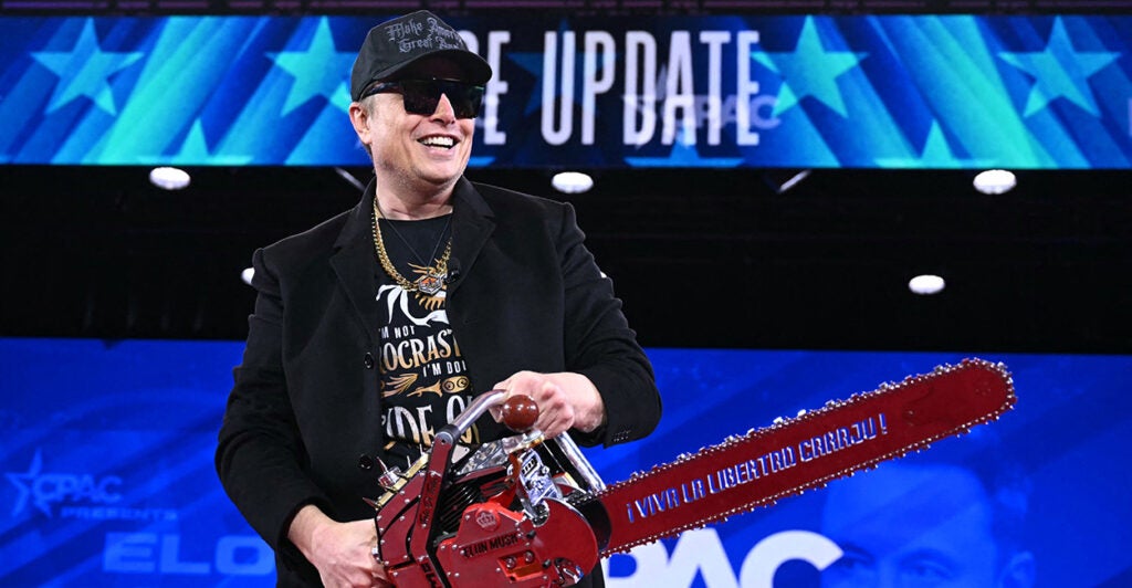 Then-Department of Government Efficiency chief Elon Musk used a chain saw as a metaphor for cutting wasteful federal spending.