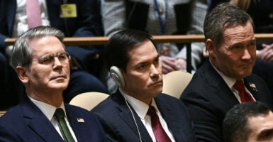 Flanked by Secretary of the Treasury Scott Bessent (left) and U.S. Ambassador to the U.N. Michael Waltz (right), Secretary of State Marco Rubio listens as President Donald Trump delivers remarks to the United Nations General Assembly at U.N. headquarters in New York City on Tuesday.