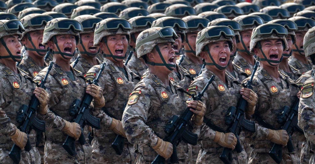 Chinese soldiers march during a military parade in Tiananmen Square in Beijing.