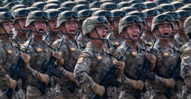 Chinese soldiers march during a military parade in Tiananmen Square in Beijing.