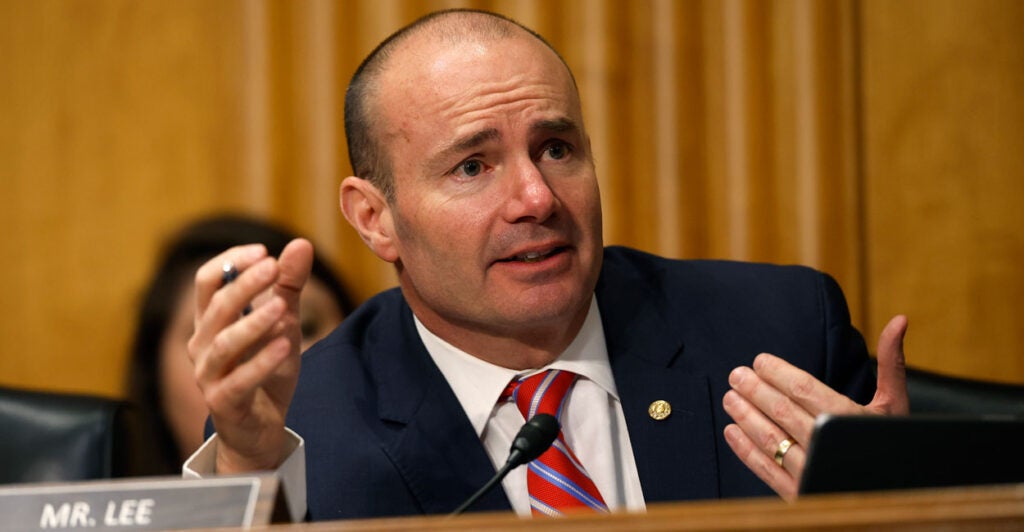 Sen. Mike Lee, R-Utah, speaks and gestures at a Senate committee hearing.