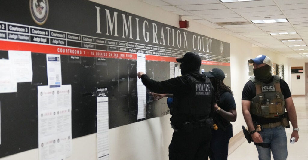 Immigration and Customs Enforcement agents are seen inside the federal plaza courthouse in New York on June 27.