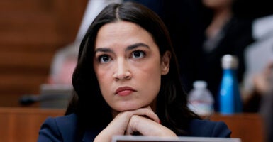 Alexandria Ocasio Cortez, who backs the congressional stock trading ban, is seen at House of Representatives hearing.