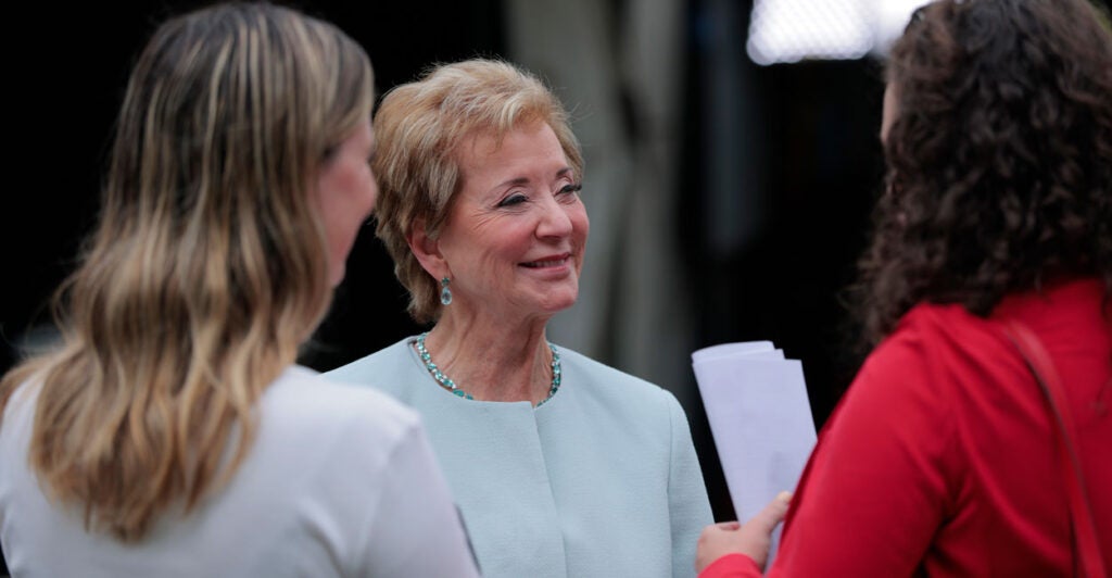 Education Secretary Linda McMahon speaks with her staff outside of the White House.